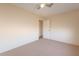 Neutral bedroom with a door leading to another room, and plush carpet at 12613 N 51St Dr, Glendale, AZ 85304