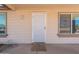 Close-up of front door showcasing security screen, visible house number (12613), and exterior wall paint at 12613 N 51St Dr, Glendale, AZ 85304