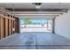 Spacious garage with an automatic door and ample storage space, providing convenient parking and organization at 12613 N 51St Dr, Glendale, AZ 85304