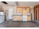 Functional garage space with built-in cabinets and a workbench area, ideal for projects and storage at 12613 N 51St Dr, Glendale, AZ 85304
