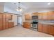 Spacious kitchen with stainless steel appliances, ample maple cabinets and granite counters at 12613 N 51St Dr, Glendale, AZ 85304