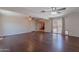 Bright living room featuring hardwood floors and access to the backyard and kitchen at 12613 N 51St Dr, Glendale, AZ 85304