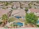This aerial backyard shows a pool, covered patio, basketball hoop, and low maintenance landscaping at 1383 E Prescott Pl, Chandler, AZ 85249