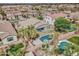 Aerial view of a backyard pool and landscaping. Also features a covered patio at 1383 E Prescott Pl, Chandler, AZ 85249