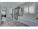 Bright bathroom featuring a soaking tub, glass enclosed shower, and natural light at 1383 E Prescott Pl, Chandler, AZ 85249