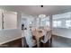 Open dining room space featuring a wood table with chairs, chandelier, and an open view to the foyer at 1383 E Prescott Pl, Chandler, AZ 85249