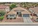 A well-maintained one story home features a neatly landscaped front yard with desert landscaping and a two-car garage at 1383 E Prescott Pl, Chandler, AZ 85249
