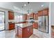 Spacious kitchen with stainless steel appliances, granite countertops, and a large island for food preparation at 1383 E Prescott Pl, Chandler, AZ 85249