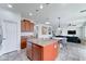 Open-concept kitchen with large island, granite countertops and view of living area and breakfast nook at 1383 E Prescott Pl, Chandler, AZ 85249