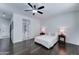 Spacious main bedroom boasts dark wood flooring, a ceiling fan, and an ensuite bathroom at 1383 E Prescott Pl, Chandler, AZ 85249