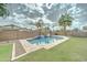 This backyard features a sparkling pool and lush greenery, ideal for relaxation and enjoying outdoor gatherings at 1383 E Prescott Pl, Chandler, AZ 85249