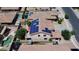 Aerial view of a desert home with solar panels, pool, and generous backyard space, ideal for outdoor enjoyment at 15241 W Madison St, Goodyear, AZ 85338