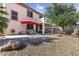 Spacious backyard with patio, outdoor dining, and desert landscaping, perfect for relaxation at 15241 W Madison St, Goodyear, AZ 85338