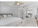 Bright bedroom features a ceiling fan, large closet, and neutral-toned walls at 15241 W Madison St, Goodyear, AZ 85338