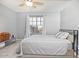 Cozy bedroom featuring a bed, natural light, and stylish decor at 15241 W Madison St, Goodyear, AZ 85338
