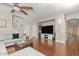 Comfortable living room with modern ceiling fan, and a large TV entertainment center at 15241 W Madison St, Goodyear, AZ 85338
