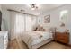 Cozy bedroom with natural light, a neutral color palette, and comfortable furnishings at 15488 W Aster Dr, Surprise, AZ 85379