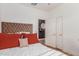 Cozy bedroom with a plush upholstered headboard and stylish bedside lighting at 15488 W Aster Dr, Surprise, AZ 85379