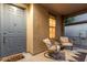 Inviting front porch with cozy seating, a stylish rug, and a welcoming entrance at 15488 W Aster Dr, Surprise, AZ 85379