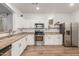 Spacious kitchen featuring stainless steel appliances, granite countertops, and ample cabinet space at 15488 W Aster Dr, Surprise, AZ 85379