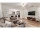 Inviting living room featuring an open layout, wood floors, and neutral color palette at 15488 W Aster Dr, Surprise, AZ 85379