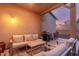 Outdoor patio with a comfortable seating area, table and grill for entertaining at 15488 W Aster Dr, Surprise, AZ 85379