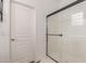 Bathroom featuring glass enclosed shower with modern fixtures and tiled walls at 15488 W Aster Dr, Surprise, AZ 85379