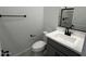 Clean bathroom features a vanity with a white sink, a toilet, and a shower with a black shower head at 17481 W Fulton St, Goodyear, AZ 85338