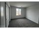 Bedroom with carpeted floors and a window with a view to the outside at 17481 W Fulton St, Goodyear, AZ 85338