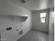 Laundry room with tile floors and washer and dryer hook-ups at 17481 W Fulton St, Goodyear, AZ 85338