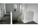 Bright staircase with white railings and carpeted steps leading to the upper level of the home at 17481 W Fulton St, Goodyear, AZ 85338