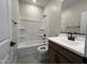 Clean bathroom with a shower-tub combo, vanity with storage, and modern fixtures at 17505 W Fulton St, Goodyear, AZ 85338