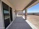 Spacious covered patio offers an ideal outdoor space for relaxation and entertaining with a large backyard at 17505 W Fulton St, Goodyear, AZ 85338