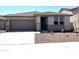 Charming single-story home featuring a two-car garage and low-maintenance desert landscaping at 17505 W Fulton St, Goodyear, AZ 85338