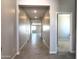 Long hallway with tile flooring provides a bright, open feel leading to other rooms at 17505 W Fulton St, Goodyear, AZ 85338