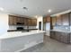 Modern kitchen with quartz countertops, stainless appliances, and ample cabinet space at 17505 W Fulton St, Goodyear, AZ 85338