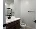 Bathroom featuring a modern vanity, sink, and a well-lit mirror for functionality at 17511 W Fulton St, Goodyear, AZ 85338