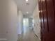 Bright entryway featuring tiled floors and leading into the home's open layout at 17511 W Fulton St, Goodyear, AZ 85338