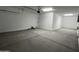 This is a spacious garage with sealed concrete floors and plenty of room for storage at 17511 W Fulton St, Goodyear, AZ 85338
