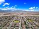 Scenic community aerial view, showcasing green common areas, and mountain views in the distance at 18495 W Rimrock St, Surprise, AZ 85388