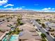 Desert community featuring many single Gathering homes equipped with solar panels, pools, and desert landscaping at 18495 W Rimrock St, Surprise, AZ 85388