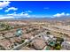 Overhead view of a residential area featuring beautifully landscaped houses and swimming pools, set against mountain backdrop at 18495 W Rimrock St, Surprise, AZ 85388