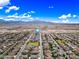 Community aerial view with lush green spaces, mountain views, and clear blue skies at 18495 W Rimrock St, Surprise, AZ 85388