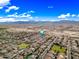 Wide aerial shot captures a community nestled in a desert landscape with majestic mountains in the distance at 18495 W Rimrock St, Surprise, AZ 85388
