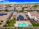 Real estate showcasing solar panels, a pool, hot tub, and a well-maintained backyard with desert landscaping at 18495 W Rimrock St, Surprise, AZ 85388
