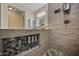 Bathroom featuring tiled walk-in shower with bench and niche and custom designed vanity at 18495 W Rimrock St, Surprise, AZ 85388