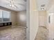 Bedroom with tile flooring and view into hallway at 18495 W Rimrock St, Surprise, AZ 85388