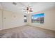 Spacious bedroom with carpet, large windows overlooking the pool, and plenty of natural light at 18495 W Rimrock St, Surprise, AZ 85388