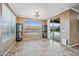Spacious dining room with tile floors, windows, and sliding glass door to backyard at 18495 W Rimrock St, Surprise, AZ 85388