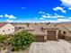Beautiful single Gathering home featuring a well-manicured lawn, desert landscaping, and a three-car garage at 18495 W Rimrock St, Surprise, AZ 85388